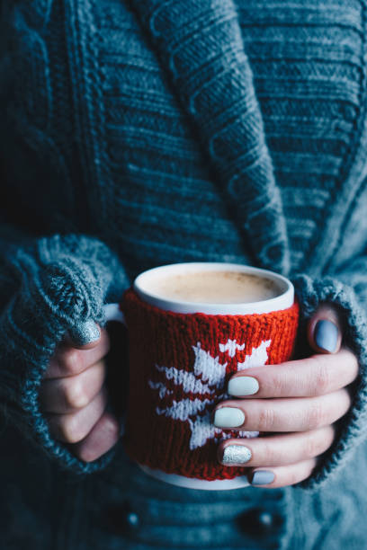 istock female hands holding cup of cacao 856385992