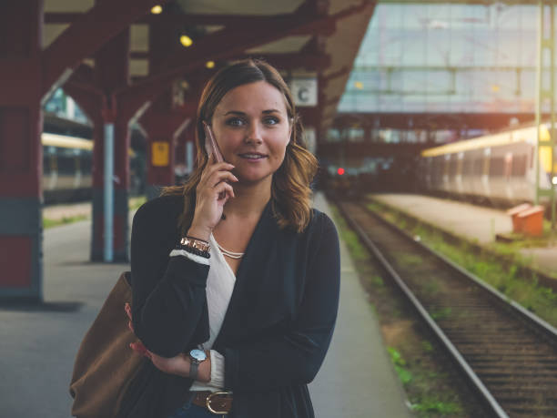istock Young Woman Waiting for the Train 856389316