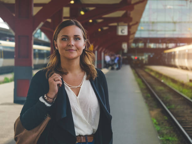 istock Young Woman Waiting for the Train 856389320