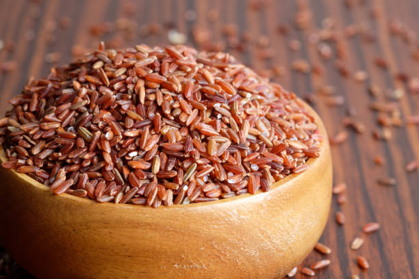 istock Red rice in wooden bowl 856397940