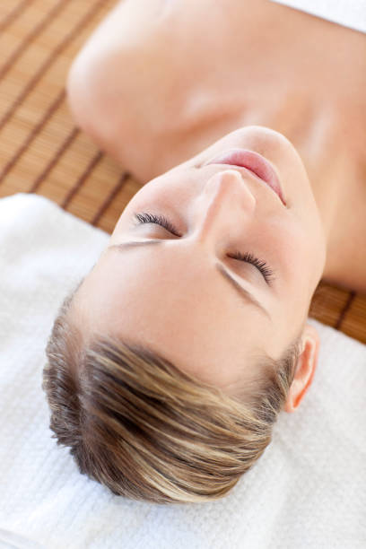 istock Portrait of a beautiful young woman lying on a massage table 856400592