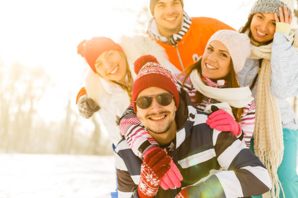 istock Portrait of smiling friends in snow 856401186