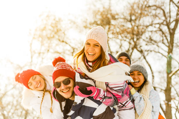 istock Portrait of smiling friends in snow 856401188