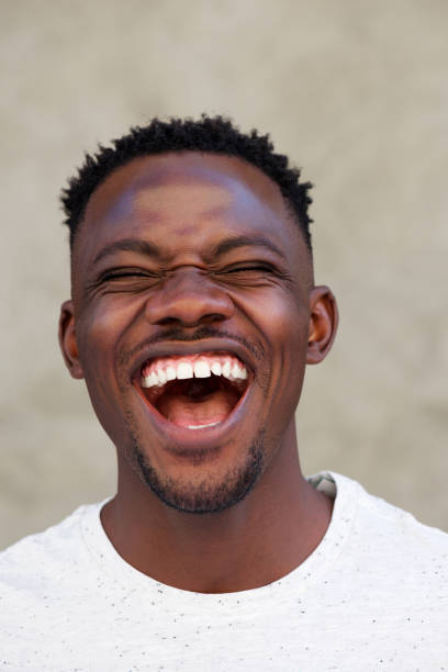 istock laughing young african american man 856404018