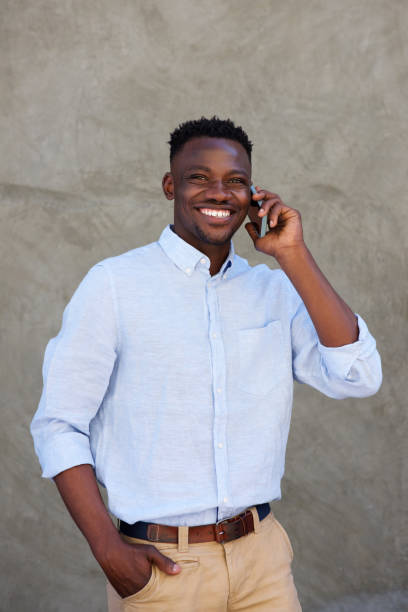 istock handsome young african american man making a phone call 856406862