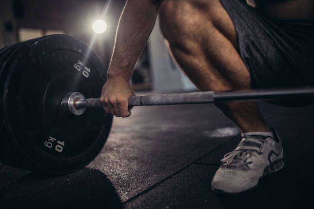 istock Man gripping the gym bar 856409868