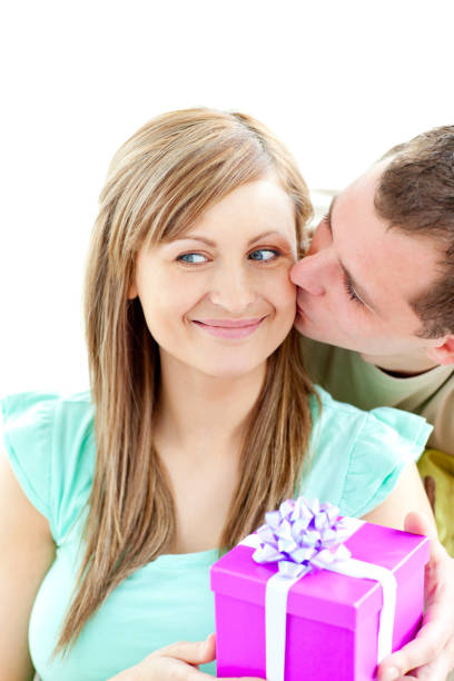 istock Attractive boyfriend giving a present to his smiling girlfriend 856409992