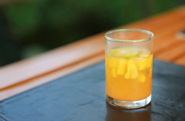 istock Glasses of orange juice mixed fruits salad on the table. 856410178