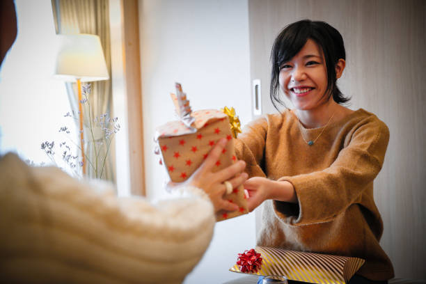 istock Women enjoy Christmas gifts exchange 856421014