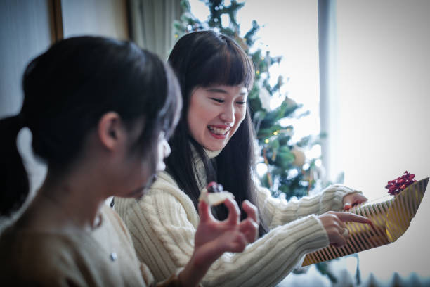 istock Women enjoying a Christmas party at a friend's house 856421028