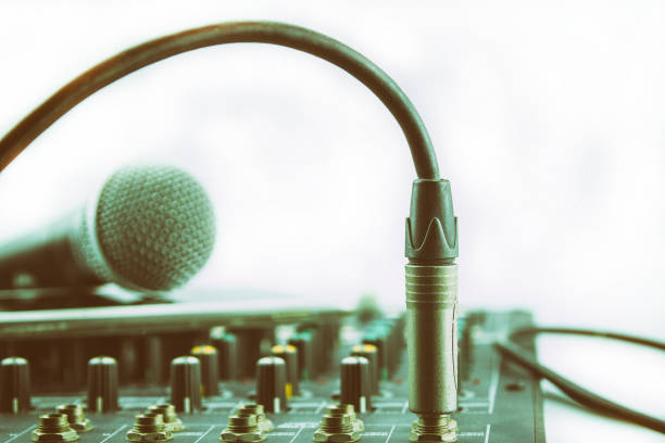 istock Phone jacks and cables from the audio mixer to the microphone. 856421762