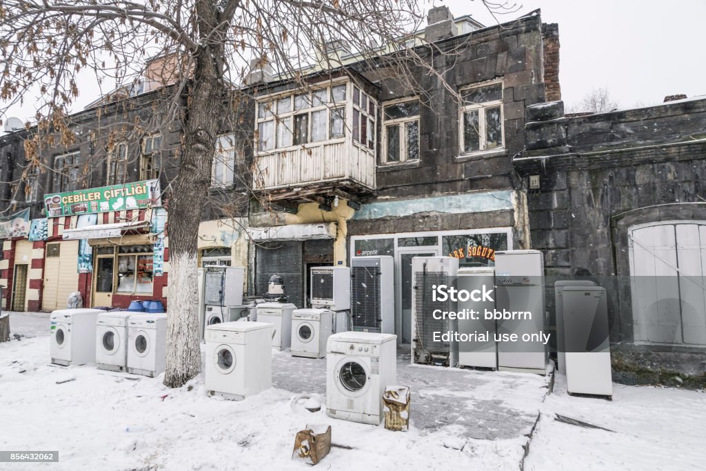 Secondhand White Goods piled up outside of shop in Turkey. Secondhand White Goods piled up outside of shop in Kars city of Turkey. Appliance Stock Photo