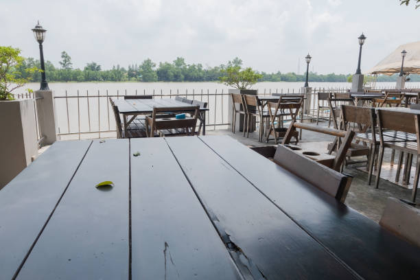 istock Wooden table and chair outdoor at Riverside 856434648