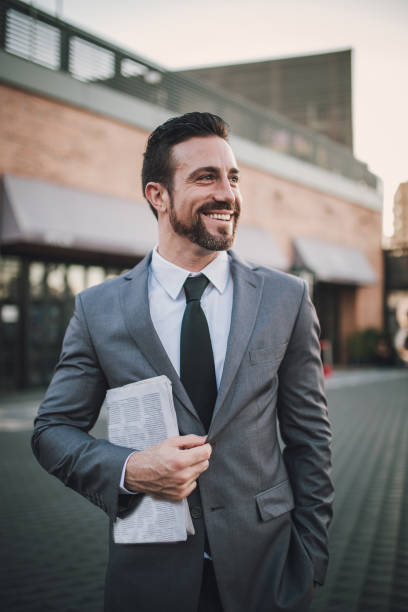 istock Charming man in gray suit 856444518