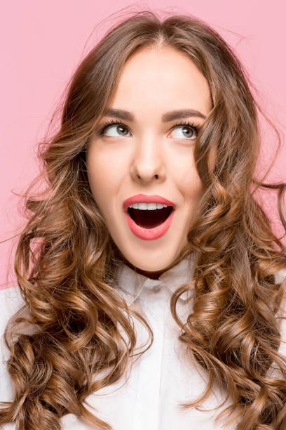 istock Surprised happy beautiful woman looking in excitement 856448712