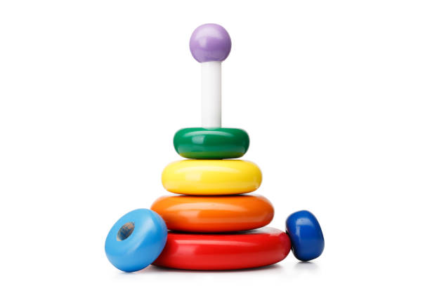 istock A pyramid build from rings, isolated on a white background. Colorful wooden toys for babies. Learning child pyramid toy. 856449054
