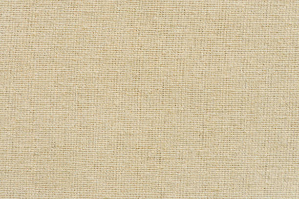 Brown cotton fabric cloth texture for background, natural textile pattern.