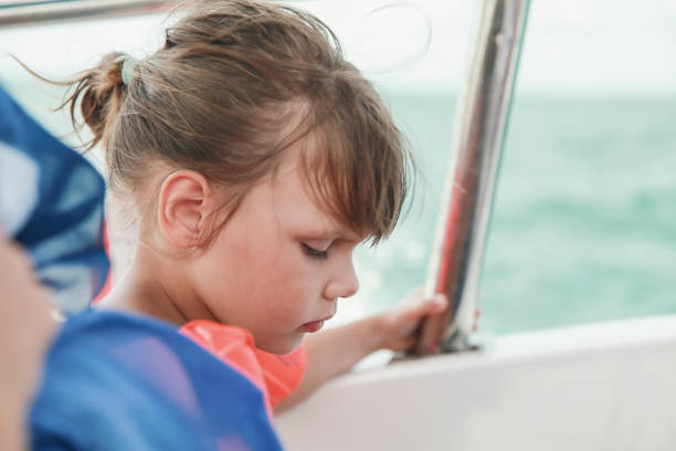istock Llittle girl in life-jacket as passenger of boat 856477216