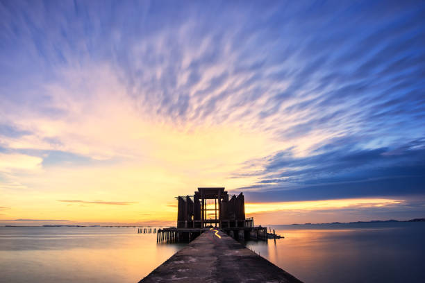 istock Beautiful skyline background after sunset with walking path leading to abandon temple,Silhouette temple in thailand 856480804