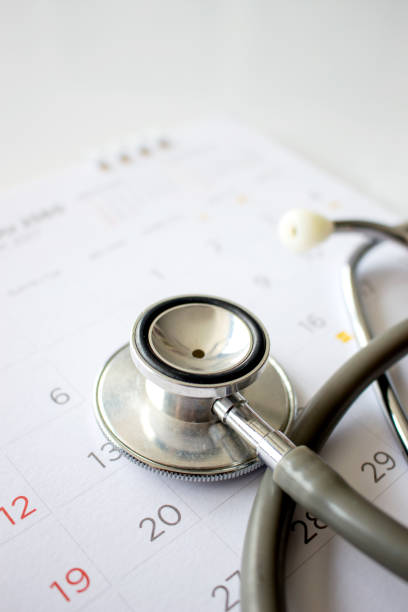 istock annual checkup concept. stethoscope on the calendar with soft-focus and over light in the background 856484146