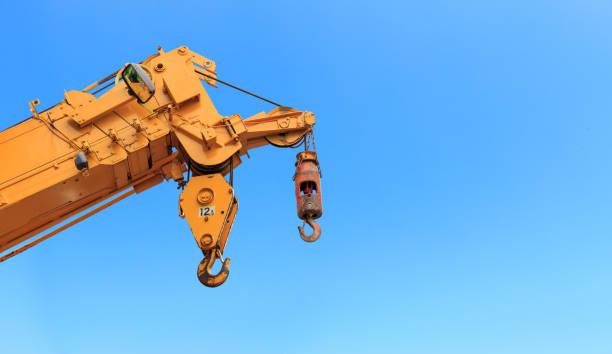 istock closeup yellow truck crane with blue sky background. over light 856484222