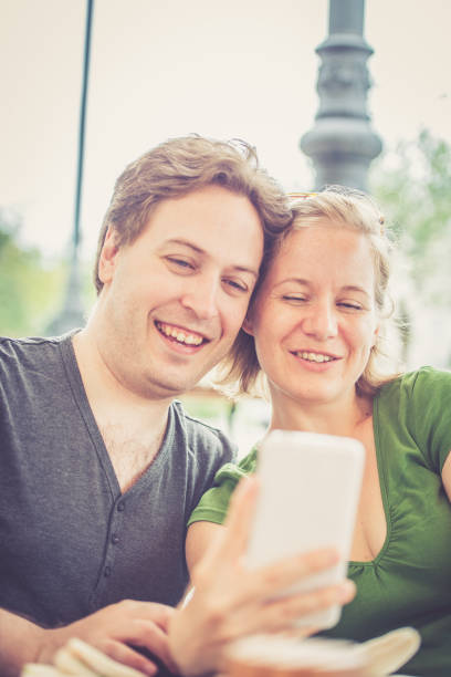 istock Couple taking selfies outdoors 856486078