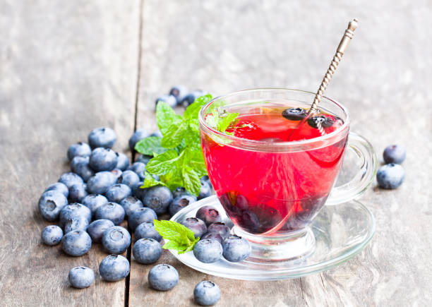 istock blueberry  tea with mint leaves on white background 856500508