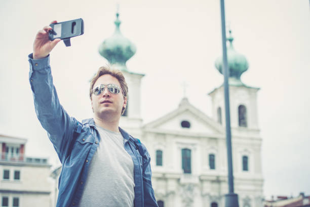 istock Man taking selfies outdoors 856500628