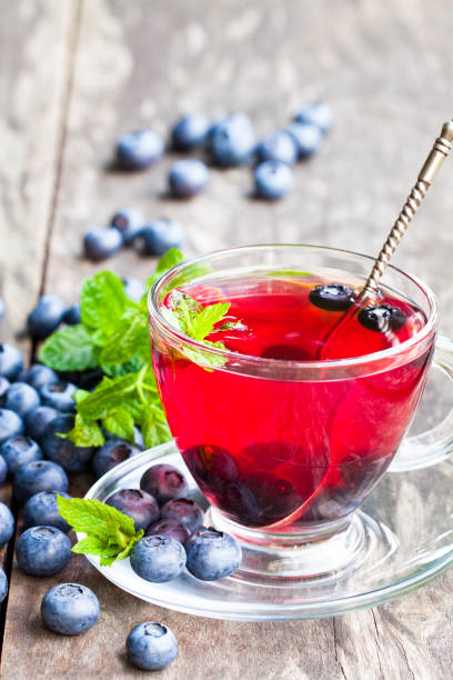 istock blueberry  tea with mint leaves on white background 856500988