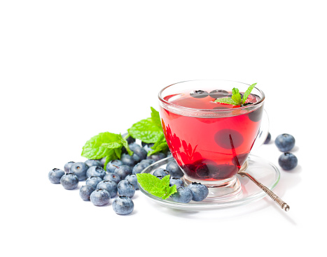 blueberry  tea with mint leaves on white background isolated
