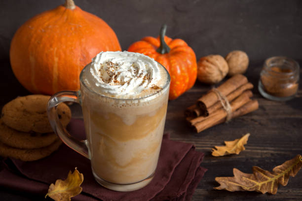 Pumpkin Spice Latte Pumpkin Spice Latte. Cup of Latte with Seasonal Autumn Spices, Cookies and Fall Decor. Traditional Coffee Drink for Autumn Holidays. latte stock pictures, royalty-free photos & images