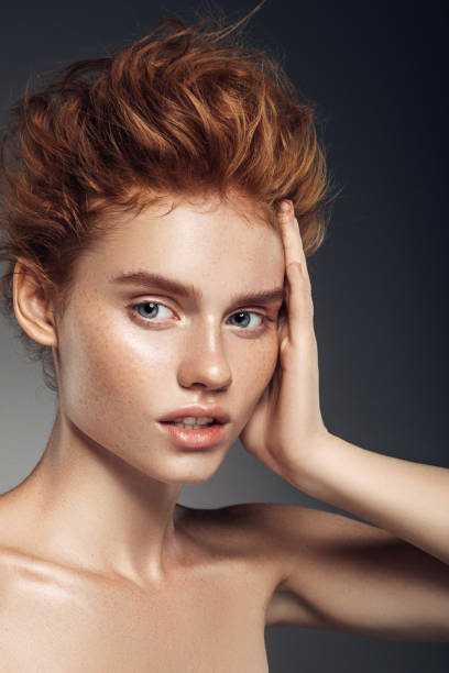 istock Red-haired girl with curls and fashionable make-up 856504098