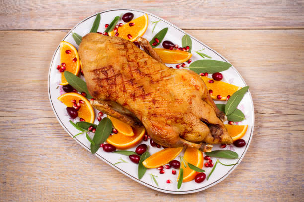 istock Whole duck with oranges, berries, sage and rosemary 856506664