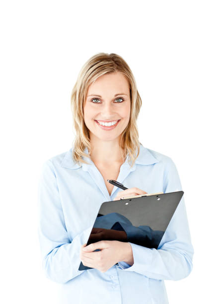 istock Glowing young businesswoman taking notes on her clipboard 856507630