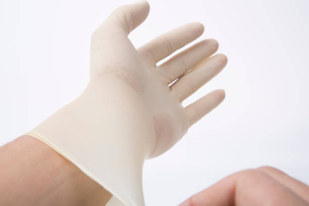 istock Man hand putting on surgical gloves-isolation over white background with clipping path. 856511322