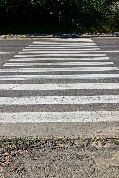 istock Pedestrian crossing on an old asphalt road 856512044