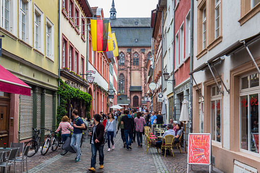 Heidelberg, Germany - May 6, 2017: Marketplace crowded with tourists and Town Hall in Heidelberg in Germany. Heidelberg is a city in Baden-Wurttemberg in Germany.