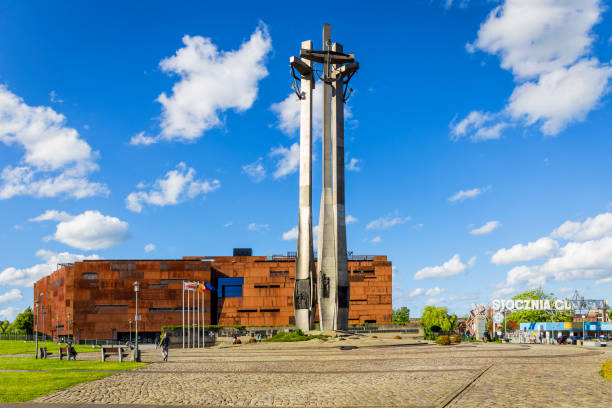 Gdansk, Poland - July 03, 2017: Monument of the Fallen Shipyard Workers before European Solidarity Centre. It is memorial of workers victims of communist regime. Behind the European Solidarity Centre, Gdansk, Poland