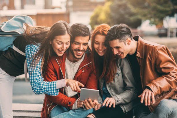 istock Friends using a tablet in the city 856525942