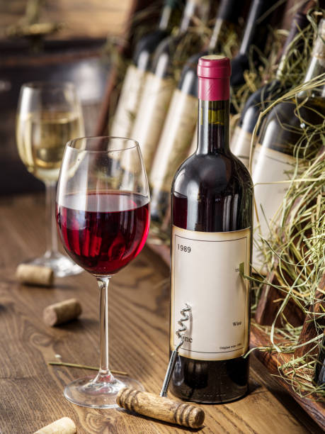istock Wine bottles on the wooden shelf. 856530586