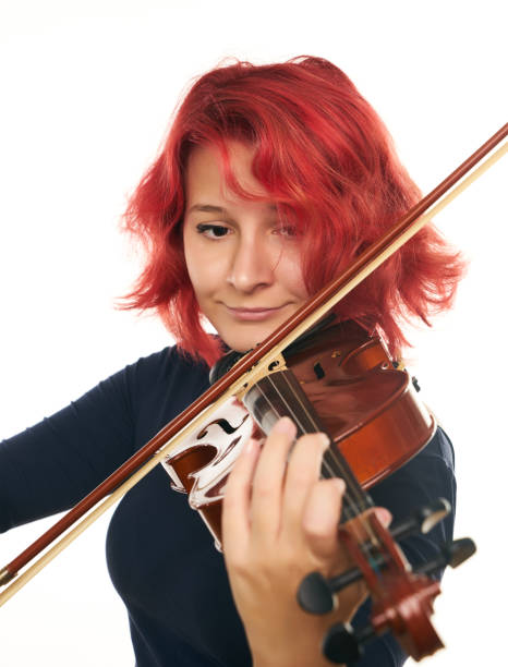 istock Musician beautiful young woman playing violin 856534058