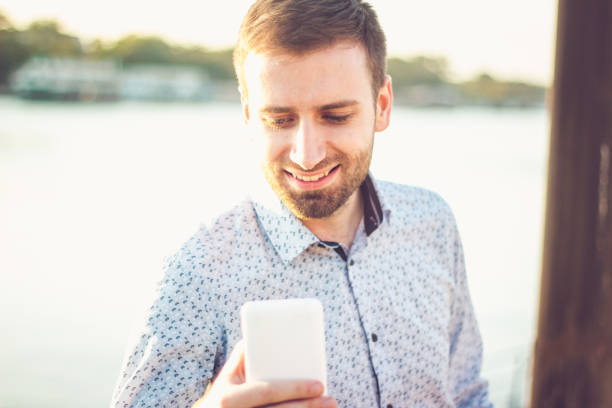 istock Man in the city looking at his smart phone 856540712