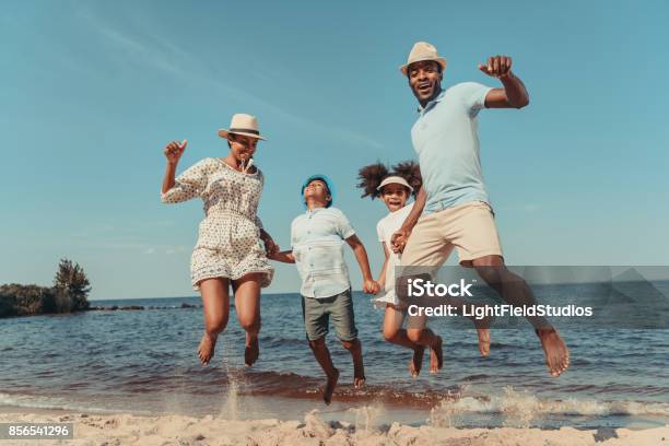 Family On Beach Stock Photo - Download Image Now - Family, Vacations, Beach