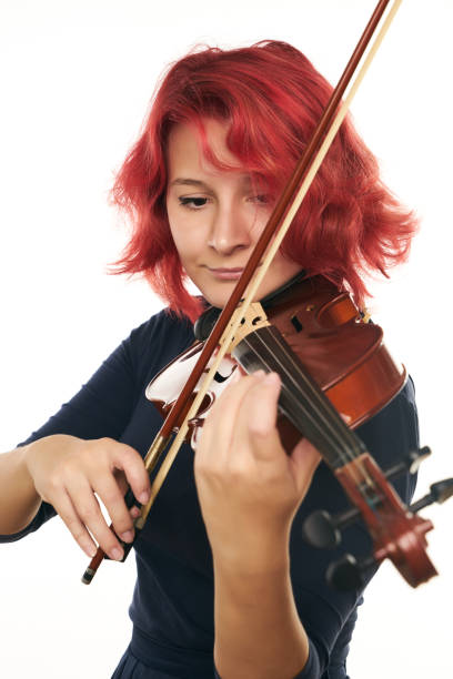 istock Musician beautiful young woman playing violin 856541604