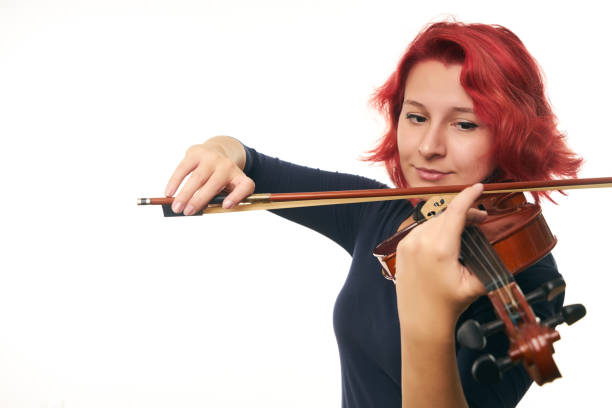 istock Violinist young redhead woman and violin 856548068