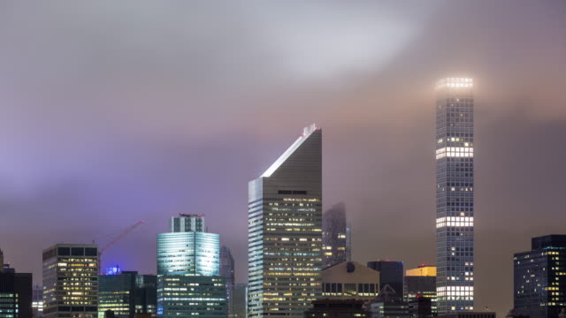 Midtown Manhattan Skyline Buildings with Clouds Night Timelapse