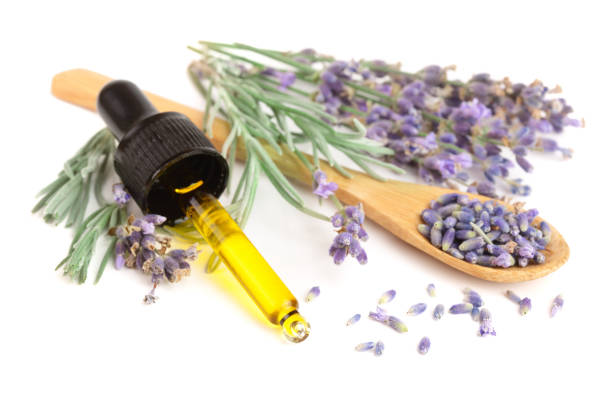 istock Bottle with aroma oil and lavender flowers isolated on white background 856552916