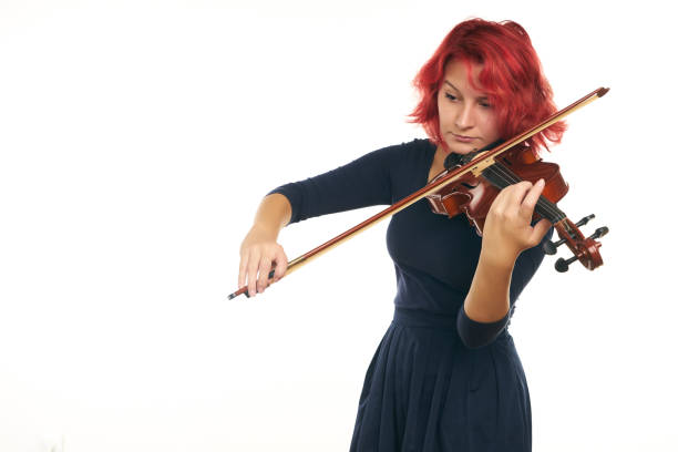 istock Musician beautiful young woman playing violin 856553144
