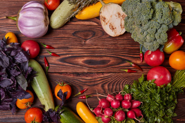 istock Fresh Vegetables on brown wooden background. 856553668