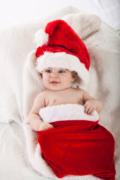 istock Happy baby in santa costume 856556410